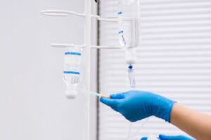 doctor-prepares-system-with-dropper-solution (2)