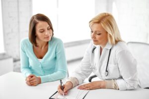 doctor-with-clipboard-woman-hospital (1)